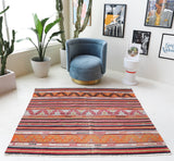 Vintage kilim rug in room decor setting, old rug, antique rug, pastel colors, faded colors, Turkish rug, vintage rug, soft rug, Portland, Oregon, rug store, rug shop, local shop, bold colors, bright colors, faded colors