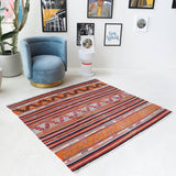 Vintage kilim rug in room decor setting, old rug, antique rug, pastel colors, faded colors, Turkish rug, vintage rug, soft rug, Portland, Oregon, rug store, rug shop, local shop, bold colors, bright colors, faded colors