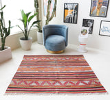 Vintage kilim rug in room decor setting, old rug, antique rug, pastel colors, faded colors, Turkish rug, vintage rug, soft rug, Portland, Oregon, rug store, rug shop, local shop, bold colors, bright colors, faded colors