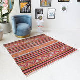 Vintage kilim rug in room decor setting, old rug, antique rug, pastel colors, faded colors, Turkish rug, vintage rug, soft rug, Portland, Oregon, rug store, rug shop, local shop, bold colors, bright colors, faded colors
