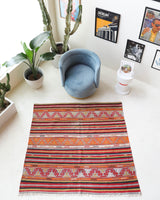 Vintage kilim rug in room decor setting, old rug, antique rug, pastel colors, faded colors, Turkish rug, vintage rug, soft rug, Portland, Oregon, rug store, rug shop, local shop, bold colors, bright colors, faded colors