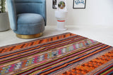 Vintage kilim rug in living room setting, bright colors, wild shaman, soft rug, bold color, Portland, Oregon, rug store, rug shop, local shop, vintage rug, modern kilim, warm colors