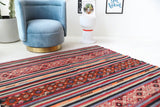 Vintage kilim rug in living room setting, bright colors, wild shaman, soft rug, bold color, Portland, Oregon, rug store, rug shop, local shop, vintage rug, modern kilim, warm colors