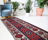 Vintage Turkish runner rug in a living room setting, pile rug, Turkish rug, vintage rug, portland, rug shop, bright colors, wild shaman, soft rug, bold color, Portland, Oregon, rug store, rug shop, local shop, antique rug