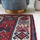 Vintage Turkish runner rug in a living room setting, pile rug, Turkish rug, vintage rug, portland, rug shop, bright colors, wild shaman, soft rug, bold color, Portland, Oregon, rug store, rug shop, local shop, antique rug