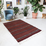 Vintage kilim rug in room decor setting, old rug, antique rug, pastel colors, faded colors, Turkish rug, vintage rug, soft rug, Portland, Oregon, rug store, rug shop, local shop, bold colors, bright colors, faded colors