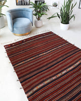 Vintage kilim rug in room decor setting, old rug, antique rug, pastel colors, faded colors, Turkish rug, vintage rug, soft rug, Portland, Oregon, rug store, rug shop, local shop, bold colors, bright colors, faded colors