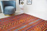Vintage kilim rug in living room setting, bright colors, wild shaman, soft rug, bold color, Portland, Oregon, rug store, rug shop, local shop, vintage rug, modern kilim, warm colors