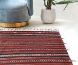 Vintage kilim rug in room decor setting, old rug, antique rug, pastel colors, faded colors, Turkish rug, vintage rug, soft rug, Portland, Oregon, rug store, rug shop, local shop, bold colors, bright colors, faded colors