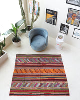 Vintage kilim rug in living room setting, bright colors, wild shaman, soft rug, bold color, Portland, Oregon, rug store, rug shop, local shop, vintage rug, modern kilim, warm colors