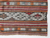 Vintage kilim rug in living room setting, old rug, antique rug, pastel colors, faded colors, Turkish rug, vintage rug, soft rug, Portland, Oregon, rug store, rug shop, local shop, earthy tones, earthy colors, warm colors