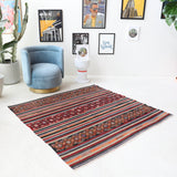 Vintage kilim rug in living room setting, bright colors, wild shaman, soft rug, bold color, Portland, Oregon, rug store, rug shop, local shop, vintage rug, modern kilim, warm colors