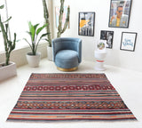 Vintage kilim rug in living room setting, bright colors, wild shaman, soft rug, bold color, Portland, Oregon, rug store, rug shop, local shop, vintage rug, modern kilim, warm colors