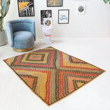 Vintage kilim rug in living room setting, bright colors, wild shaman, soft rug, bold color, Portland, Oregon, rug store, rug shop, local shop, vintage rug, modern kilim, warm colors