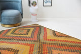 Vintage kilim rug in living room setting, bright colors, wild shaman, soft rug, bold color, Portland, Oregon, rug store, rug shop, local shop, vintage rug, modern kilim, warm colors