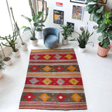 Vintage kilim rug in living room setting, bright colors, wild shaman, soft rug, bold color, Portland, Oregon, rug store, rug shop, local shop, vintage rug, modern kilim, warm colors