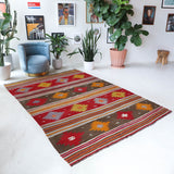 Vintage kilim rug in living room setting, bright colors, wild shaman, soft rug, bold color, Portland, Oregon, rug store, rug shop, local shop, vintage rug, modern kilim, warm colors