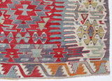Vintage kilim rug in room decor setting, old rug, antique rug, pastel colors, faded colors, Turkish rug, vintage rug, soft rug, Portland, Oregon, rug store, rug shop, local shop, bold colors, bright colors, faded colors