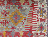 Vintage kilim rug in room decor setting, old rug, antique rug, pastel colors, faded colors, Turkish rug, vintage rug, soft rug, Portland, Oregon, rug store, rug shop, local shop, bold colors, bright colors, faded colors