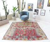 Vintage kilim rug in room decor setting, old rug, antique rug, pastel colors, faded colors, Turkish rug, vintage rug, soft rug, Portland, Oregon, rug store, rug shop, local shop, bold colors, bright colors, faded colors