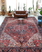 Antique Persian area rug in a living room setting, pile rug, vintage rug, portland, rug shop, bright colors, wild shaman, soft rug, bold color, Portland, Oregon, rug store, rug shop, local shop, antique rug, Persian rug, handmade rug, wool rug, distressed rug