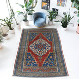 Vintage Turkish rug in a living room setting, Area rug in a living room setting, pile rug, Turkish rug, custom rug, modern rug, portland, rug shop, bright colors, wild shaman, soft rug, bold color, Portland, Oregon, rug store, rug shop, local shop