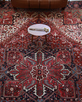 Antique Persian area rug in a living room setting, pile rug, vintage rug, portland, rug shop, bright colors, wild shaman, soft rug, bold color, Portland, Oregon, rug store, rug shop, local shop, antique rug, Persian rug, handmade rug, wool rug, distressed rug