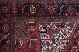 Antique Persian area rug in a living room setting, pile rug, vintage rug, portland, rug shop, bright colors, wild shaman, soft rug, bold color, Portland, Oregon, rug store, rug shop, local shop, antique rug, Persian rug, handmade rug, wool rug, distressed rug