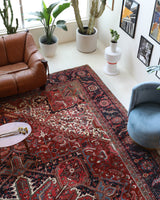 Antique Persian area rug in a living room setting, pile rug, vintage rug, portland, rug shop, bright colors, wild shaman, soft rug, bold color, Portland, Oregon, rug store, rug shop, local shop, antique rug, Persian rug, handmade rug, wool rug, distressed rug