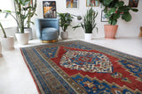 Vintage Turkish rug in a living room setting, Area rug in a living room setting, pile rug, Turkish rug, custom rug, modern rug, portland, rug shop, bright colors, wild shaman, soft rug, bold color, Portland, Oregon, rug store, rug shop, local shop