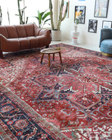 Antique Persian area rug in a living room setting, pile rug, vintage rug, portland, rug shop, bright colors, wild shaman, soft rug, bold color, Portland, Oregon, rug store, rug shop, local shop, antique rug, Persian rug, handmade rug, wool rug, distressed rug