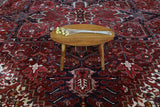 Antique Persian area rug in a living room setting, pile rug, vintage rug, portland, rug shop, bright colors, wild shaman, soft rug, bold color, Portland, Oregon, rug store, rug shop, local shop, antique rug, Persian rug, handmade rug, wool rug, distressed rug