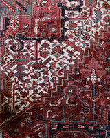 Antique Persian area rug in a living room setting, pile rug, vintage rug, portland, rug shop, bright colors, wild shaman, soft rug, bold color, Portland, Oregon, rug store, rug shop, local shop, antique rug, Persian rug, handmade rug, wool rug, distressed rug