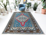 Vintage Turkish rug in a living room setting, Area rug in a living room setting, pile rug, Turkish rug, custom rug, modern rug, portland, rug shop, bright colors, wild shaman, soft rug, bold color, Portland, Oregon, rug store, rug shop, local shop