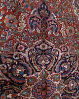 Antique Persian area rug in a living room setting, pile rug, vintage rug, portland, rug shop, bright colors, wild shaman, soft rug, bold color, Portland, Oregon, rug store, rug shop, local shop, antique rug, Persian rug, handmade rug, wool rug, distressed rug