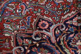 Antique Persian area rug in a living room setting, pile rug, vintage rug, portland, rug shop, bright colors, wild shaman, soft rug, bold color, Portland, Oregon, rug store, rug shop, local shop, antique rug, Persian rug, handmade rug, wool rug, distressed rug