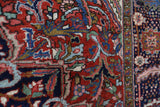Antique Persian area rug in a living room setting, pile rug, vintage rug, portland, rug shop, bright colors, wild shaman, soft rug, bold color, Portland, Oregon, rug store, rug shop, local shop, antique rug, Persian rug, handmade rug, wool rug, distressed rug