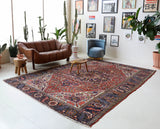 Antique Persian area rug in a living room setting, pile rug, vintage rug, portland, rug shop, bright colors, wild shaman, soft rug, bold color, Portland, Oregon, rug store, rug shop, local shop, antique rug, Persian rug, handmade rug, wool rug, distressed rug