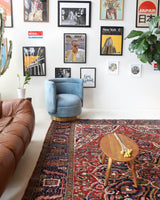 Antique Persian area rug in a living room setting, pile rug, vintage rug, portland, rug shop, bright colors, wild shaman, soft rug, bold color, Portland, Oregon, rug store, rug shop, local shop, antique rug, Persian rug, handmade rug, wool rug, distressed rug