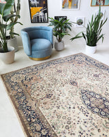 Vintage Turkish rug in a living room setting, Area rug in a living room setting, pile rug, Turkish rug, old rug, antique rug, pastel colors, faded colors, Turkish rug, vintage rug, soft rug, Portland, Oregon, rug store, rug shop, local shop, distressed rug, worn out rug
