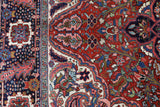 Antique Persian area rug in a living room setting, pile rug, vintage rug, portland, rug shop, bright colors, wild shaman, soft rug, bold color, Portland, Oregon, rug store, rug shop, local shop, antique rug, Persian rug, handmade rug, wool rug, distressed rug