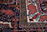 Antique Persian area rug in a living room setting, pile rug, vintage rug, portland, rug shop, bright colors, wild shaman, soft rug, bold color, Portland, Oregon, rug store, rug shop, local shop, antique rug, Persian rug, handmade rug, wool rug, distressed rug