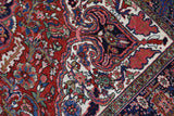 Antique Persian area rug in a living room setting, pile rug, vintage rug, portland, rug shop, bright colors, wild shaman, soft rug, bold color, Portland, Oregon, rug store, rug shop, local shop, antique rug, Persian rug, handmade rug, wool rug, distressed rug