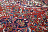 Antique Persian area rug in a living room setting, pile rug, vintage rug, portland, rug shop, bright colors, wild shaman, soft rug, bold color, Portland, Oregon, rug store, rug shop, local shop, antique rug, Persian rug, handmade rug, wool rug, distressed rug