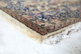 Vintage Turkish rug in a living room setting, Area rug in a living room setting, pile rug, Turkish rug, old rug, antique rug, pastel colors, faded colors, Turkish rug, vintage rug, soft rug, Portland, Oregon, rug store, rug shop, local shop, distressed rug, worn out rug