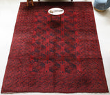 Antique Turkmen rug in a living room setting, pile rug, Turkish rug, vintage rug, portland, rug shop, bright colors, wild shaman, soft rug, bold color, Portland, Oregon, rug store, rug shop, local shop, antique rug