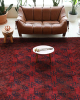 Antique Turkmen rug in a living room setting, pile rug, Turkish rug, vintage rug, portland, rug shop, bright colors, wild shaman, soft rug, bold color, Portland, Oregon, rug store, rug shop, local shop, antique rug