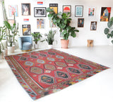 Vintage kilim rug in living room setting, old rug, antique rug, pastel colors, faded colors, Turkish rug, vintage rug, soft rug, Portland, Oregon, rug store, rug shop, local shop, earthy tones, earthy colors, warm colors