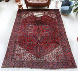 Antique Persian area rug in a living room setting, pile rug, vintage rug, portland, rug shop, bright colors, wild shaman, soft rug, bold color, Portland, Oregon, rug store, rug shop, local shop, antique rug, Persian rug, handmade rug, wool rug, distressed rug