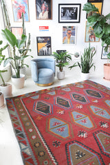 Vintage kilim rug in living room setting, old rug, antique rug, pastel colors, faded colors, Turkish rug, vintage rug, soft rug, Portland, Oregon, rug store, rug shop, local shop, earthy tones, earthy colors, warm colors